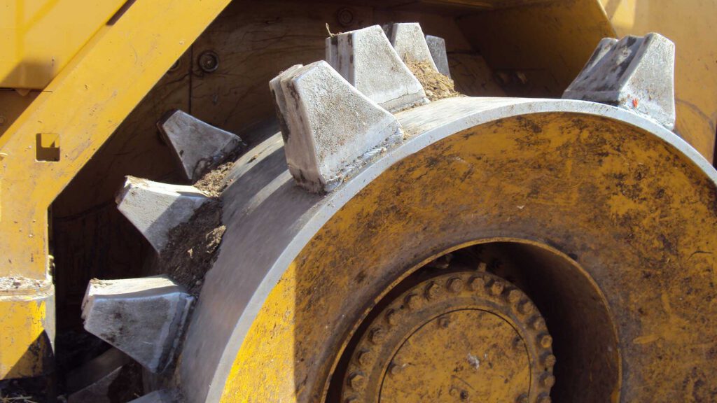 M-Trax Diamond cleats fitted to a landfill compactor wheel